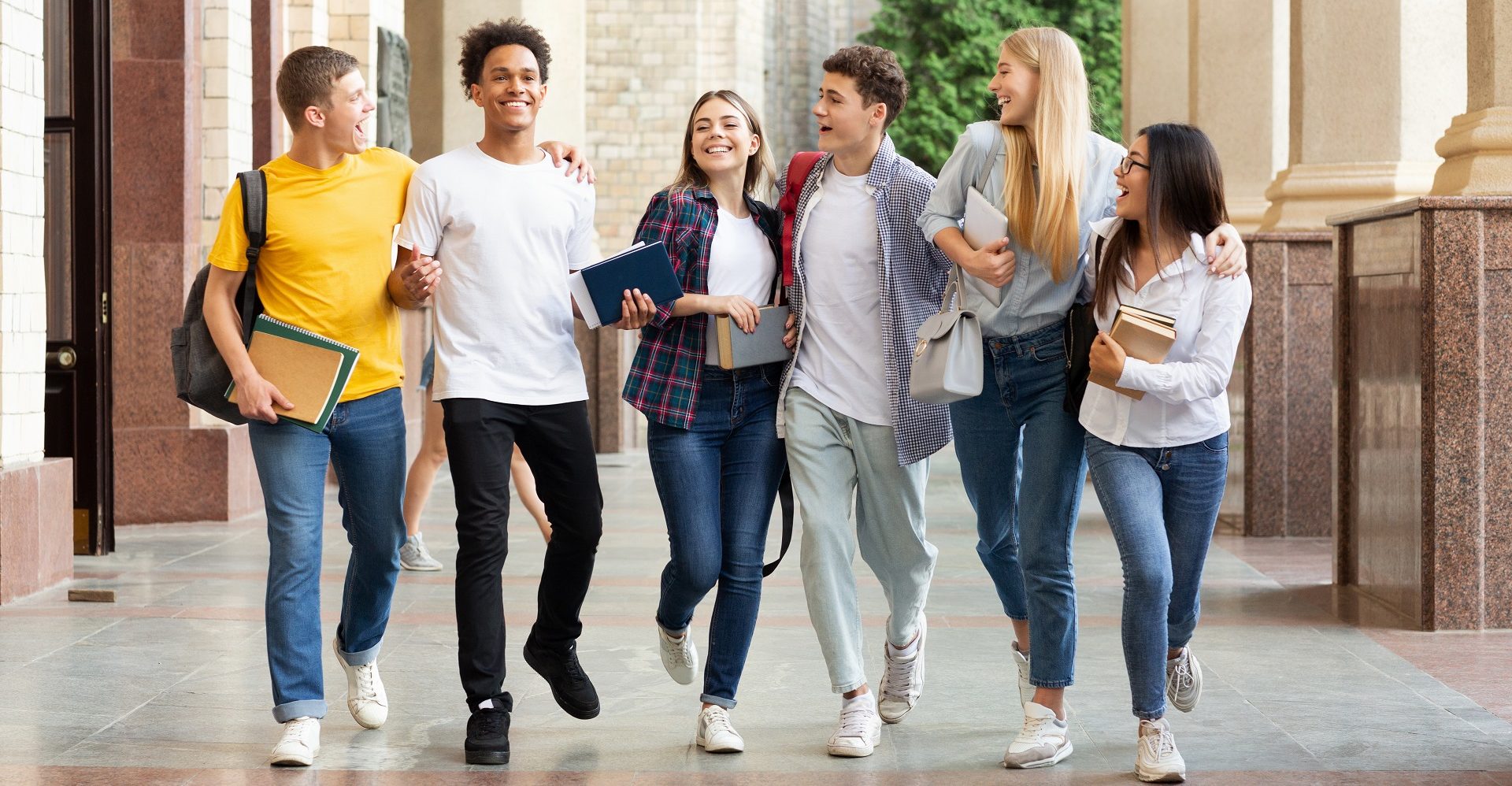 Successful tests. Students walking in university campus